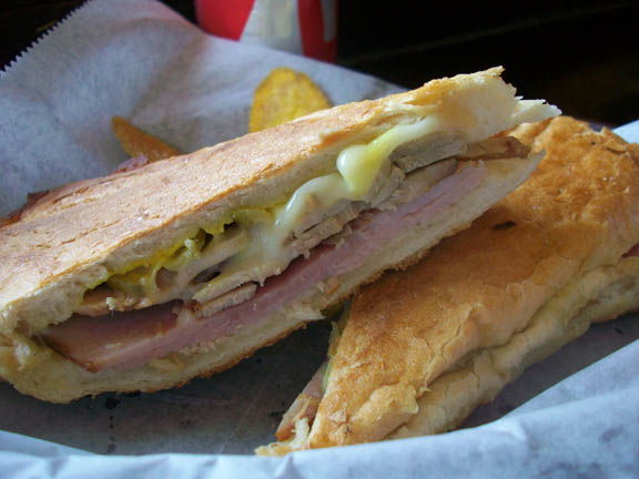 Mesquite smoked pulled pork, ham, Swiss cheese, pickle, mustard, and pickle on pressed Cuban bread
